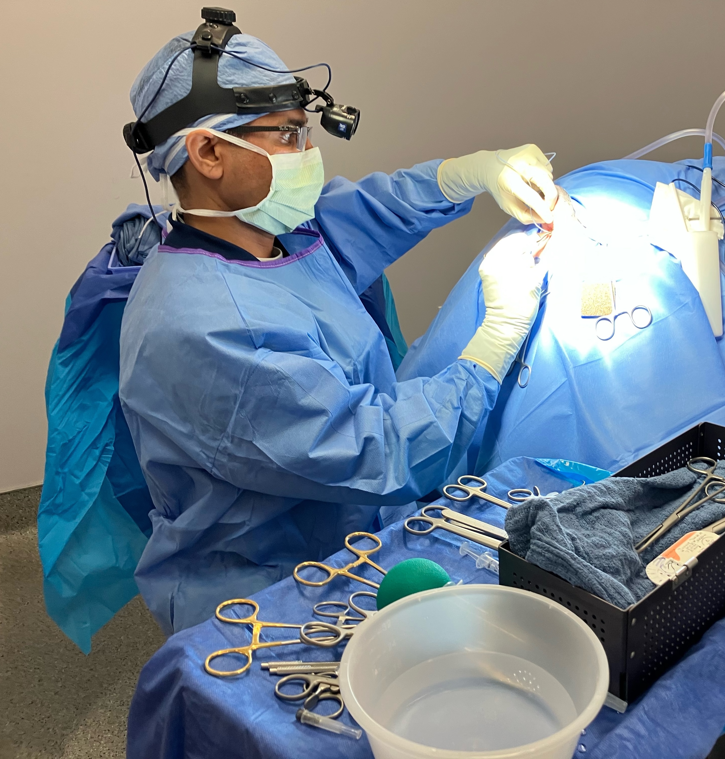 Dr. K Aulakh performing surgery